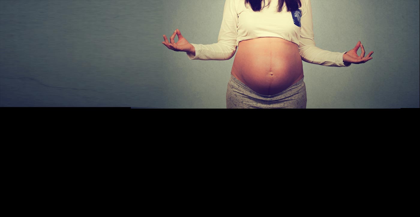 Image of a happy mum and bump showing care and love for her unborn child.