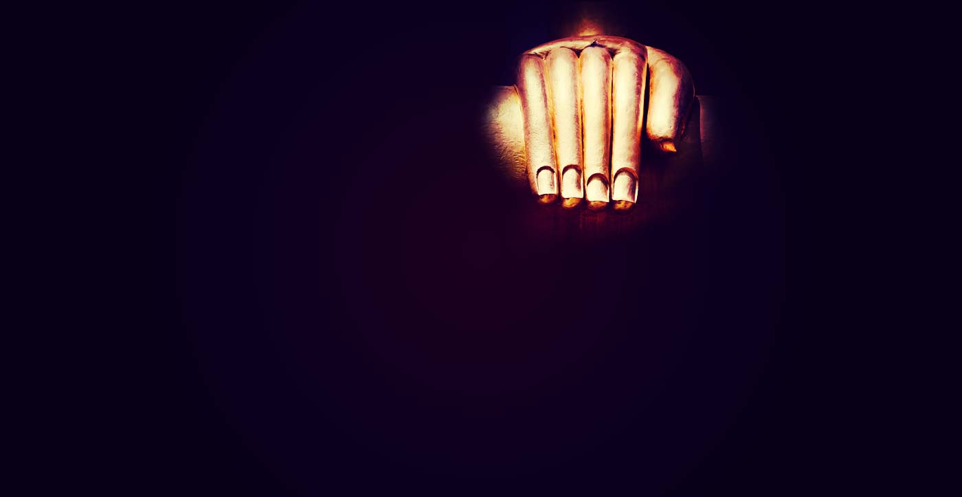 image of a meditative gold hand at rest while performing mantra